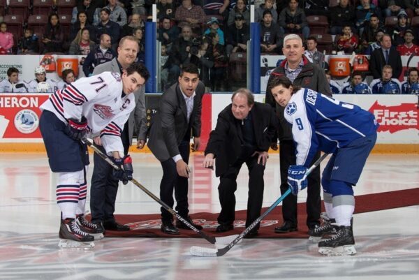 Owner of CARSTAR Oshawa Drake St., Mike Labanovich , owner of CARSTAR Pickering, Tom Akleh, owner of CARSTAR Oshawa King St., John Opasinis and Robert Howard, Campaign Director for the United Way of Durham Region dropped the puck to start the game. Photo Credit: Ian Goodall/Goodall Media Inc.